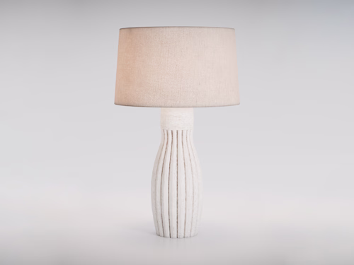 Crafted with a textured ceramic base and a softly woven fabr...