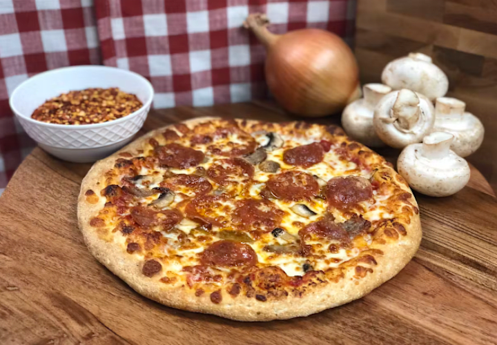 Cover image for The History of Pizza: From Italy to Your Table at Manny and Olga
