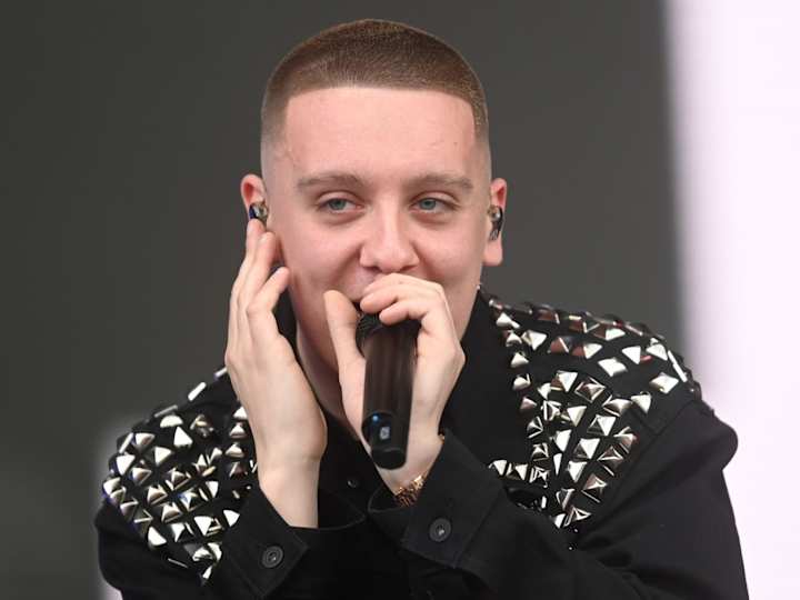 Cover image for Aitch; Manchester's Melodic Mouthpiece - Rap's Rising Star