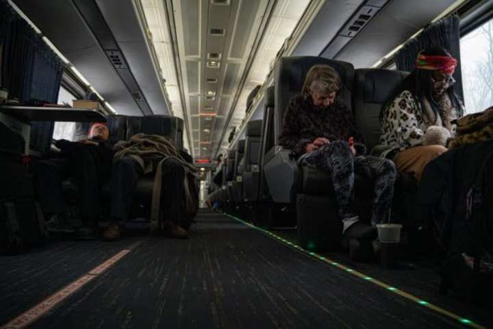 Cover image for Trump supporters ride train across country to attend inaugura...