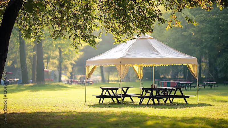 Cover image for Small marquee tent with picnic tables in a park isolated on a c…