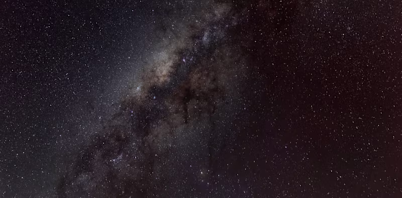 Cover image for Why is space so dark even though the universe is filled with st…